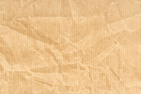 Crumpled Kraft paper texture background. Light brown colorの写真素材