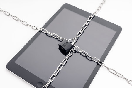Security on digital tablet. Chain and padlock on tablet. Cyber security on digital devices concept