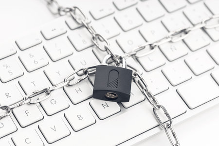 Computer Security concept. Chain and padlock on keyboard. Cyber security concept