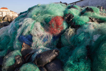 Lots of Used fishing nets waiting to be recycled on outdoorsの写真素材