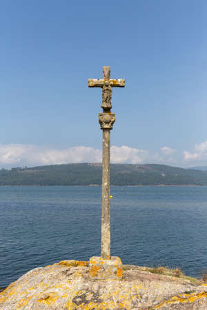 Beautiful marine landscape with stone cross called cruceiro , Rias Baixas, Galicia, Spainの写真素材