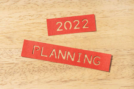 New year 2022 planning concept. Die cut Labels on wooden tableの写真素材