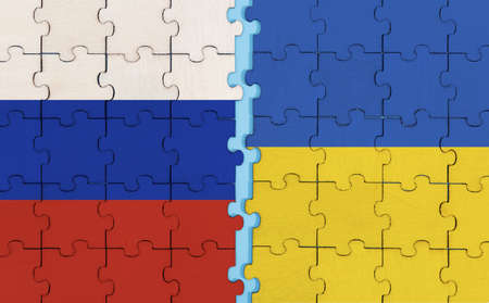 Russia and Ukraine flag on puzzle backgroundの写真素材