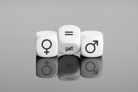 Gender equality concept. White block flipping a unequal sign to a equal sign between symbols of men and womenの写真素材