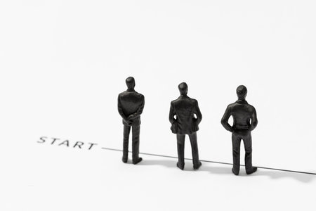 Group of Businessmen figurine on Starting line. Business start, competition, Teamwork. Copy spaceの写真素材