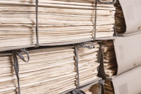 Old files stacked in folders background. Stacks of weathered working Paper documentsの写真素材
