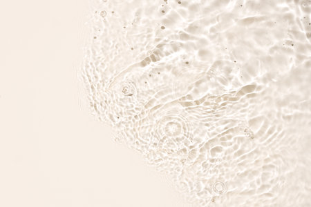 Banner of beige Abstract water background texture with ripples and waves. Copy spaceの写真素材