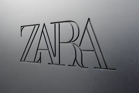 Coruna, Spain; august 29, 2023: Close up of a Zara sign logo on facade store