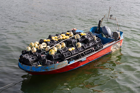 Crab boat loaded with lobster tramps moored at the dock. Galicia, Spainの写真素材