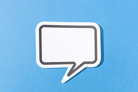 Blank Speech Bubble isolated on blue background. Mock up template