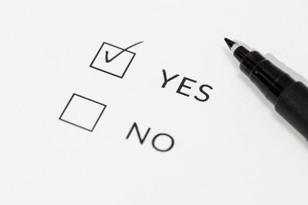 Yes or No Check boxes on white paperの写真素材