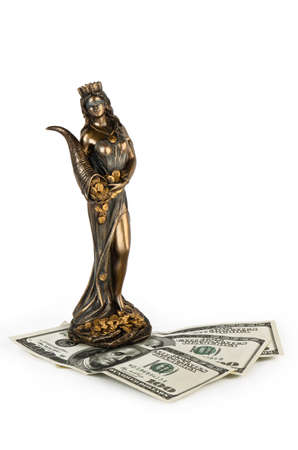 The golden statue and money on a white backgroundの写真素材