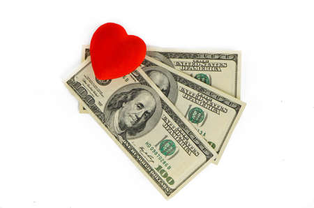 Red heart and three hundred dollars on a white backgroundの写真素材