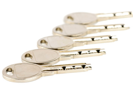 Set of metal keys on a white background