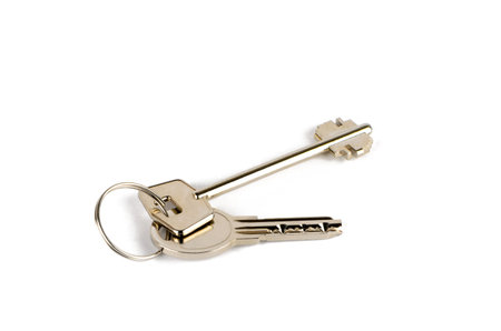 Two keys are connected by a ring on a white background