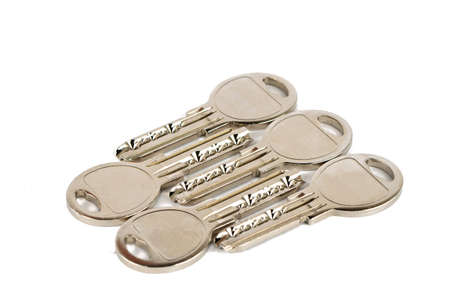 Set of metal keys on a white backgroundの写真素材