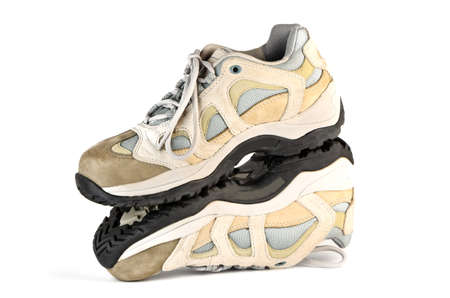 Mirror image of sneakers on a white backgroundの写真素材