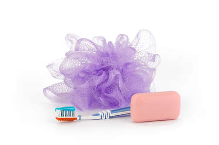Sponge, soap and a toothbrush on a white backgroundの写真素材