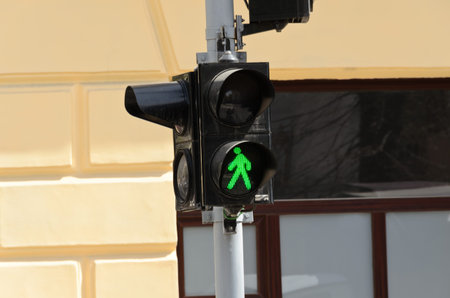 Green traffic light on a city streetの写真素材