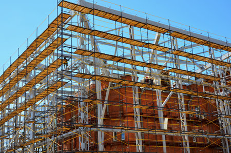 Reconstruction of a brick building against the blue sky