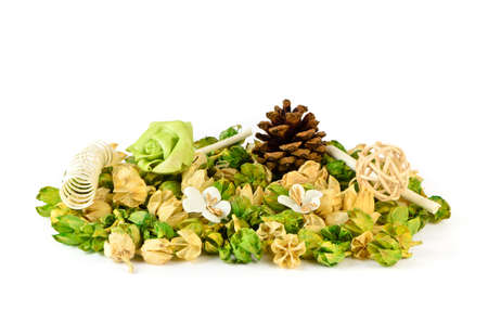 Dry potpourri with fir cones, rose wood and spring on white backgroundの写真素材