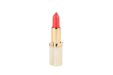 Red lipstick in gold case on a white backgroundの写真素材