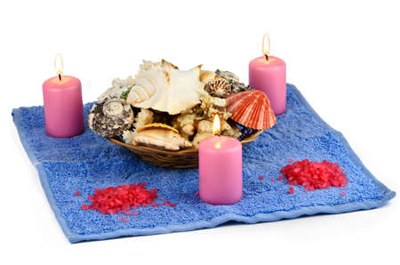 Sea salt, candles and seashells on white backgroundの写真素材