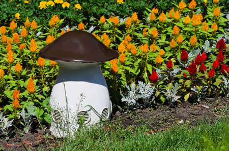 Large white, artificial mushroom among the bright colorsの写真素材