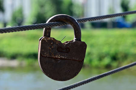 One big rusty padlock on the streetの写真素材