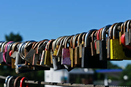 Many old locks on a background of blue skyの写真素材