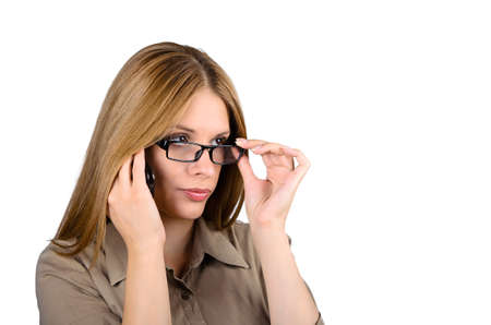 Business woman with glasses talking on the phoneの写真素材