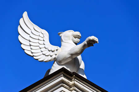 Lion with open wings in the skyの写真素材