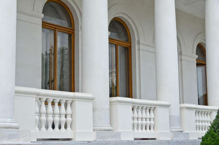 Windows, columns and balusters of an old buildingの写真素材