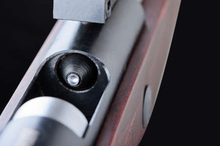 Rifle with a lead bullet closeup on white の写真素材
