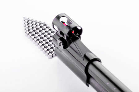 Barrel of the gun close up on a white の写真素材