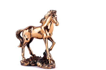Horse figurine on a white closeupの写真素材