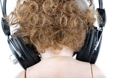Back of the head with headphones closeupの写真素材