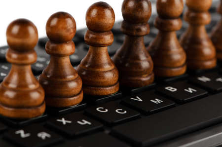 Group of black pawns on the keyboard closeupの写真素材