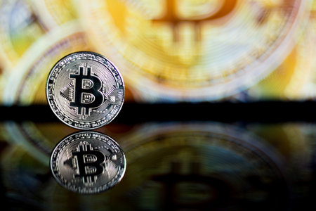 Coins of cryptocurrency or Bitcoin lying over laptop keyboard,  Business concept of worldwide...