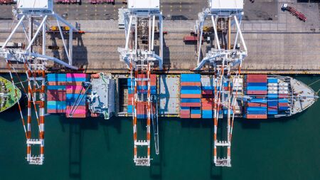 Aerial view container cargo ship freight shipping unloading at original destination port with quay crane, Business commercial global oversea logistic import export container box by container vessel .の写真素材