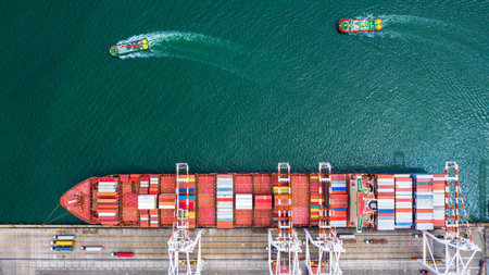 Aerial view container ship carrying container in import export business logistic and transportation of international by container ship in the open sea.の写真素材
