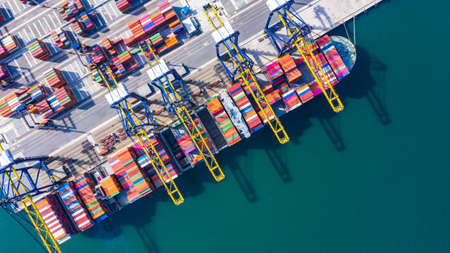 Container cargo ship loading in a port, Aerial top view container cargo ship.の写真素材