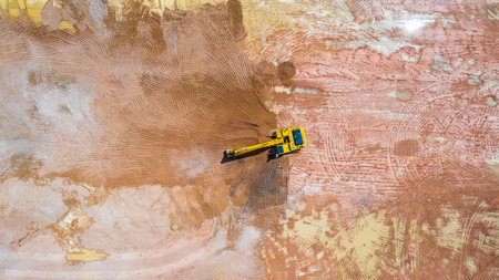 Aerial view excavator working on a construction site.の写真素材