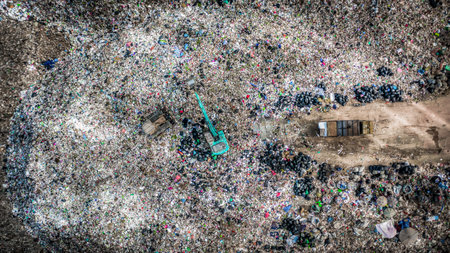 Aerial view garbage pile in trash dump landfill, Garbage pile in trash dump or landfill, Environmental pollution global warming, Garbage truck unloads rubbish in landfill waste disposal dump.の写真素材