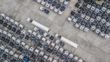 Aerial top view of semi truck cargo trailer, Semi truck trailer cargo park on parking lot, New semi truck cargo trailer at factory dealer distribution center.の写真素材