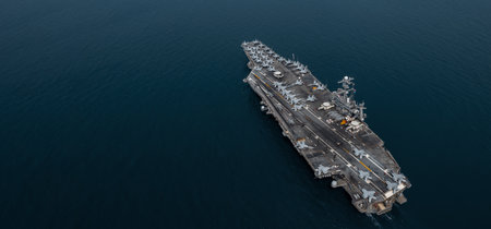 Aerial view military nuclear ship navy ship carrier full loading fighter jet aircraft, Aircraft carrier nuclear warship battleship, Military nuclear ship on the ocean.の写真素材
