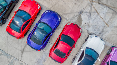 Aerial view super car show on asphalt road with tire mark, Super car park on road with tire mark background, Super car activity meeting and show.の写真素材