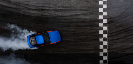 Aerial top view car drifting diffusion race drift car with lots of smoke from burning tires on speed track, Professional driver drifting car with lots of white smoke.の写真素材