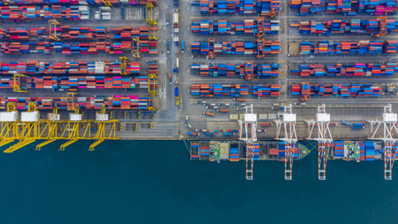 Container cargo ship at industrial port in import export business logistic and transportation...