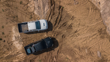 Aerial view of off-road car vehicles, Outdoor motor sport 4x4 travel, Aerial view off road pick up 4WD car vehicle, Pick up car 4WD wheel drive off road.の写真素材